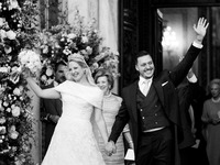 Princess Theodora Glucksburg of Greece and Matthew Jeremiah Kumar greet after their wedding at the Metropolitan Cathedral in Athens, Greece,...