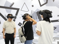 Visitors bring VR devices to experience the Digital Zhongshan Experience Museum in Nanjing, China, on September 29, 2024. (