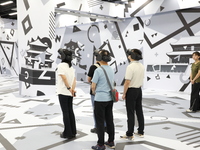 Visitors bring VR devices to experience the Digital Zhongshan Experience Museum in Nanjing, China, on September 29, 2024. (