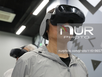 Visitors bring VR devices to experience the Digital Zhongshan Experience Museum in Nanjing, China, on September 29, 2024. (