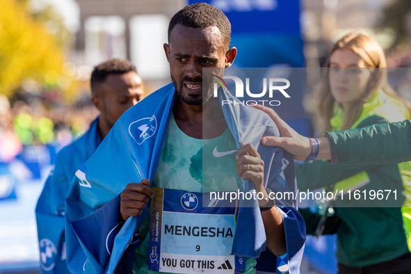 Milkesa Mengesha of Ethiopia wins the 50th Berlin Marathon in Berlin, Germany, on September 29, 2024, with a time of 2:03:17, followed by Cy...