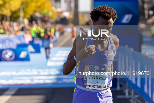 In Berlin, Germany, on September 29, 2024, Tadese Takele of Ethiopia finishes in 7th place at the Berlin Marathon. Milkesa Mengesha of Ethio...