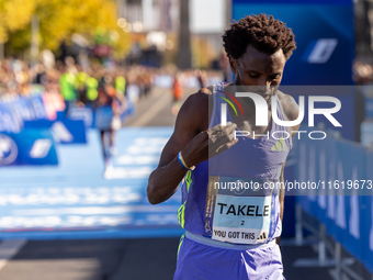 In Berlin, Germany, on September 29, 2024, Tadese Takele of Ethiopia finishes in 7th place at the Berlin Marathon. Milkesa Mengesha of Ethio...