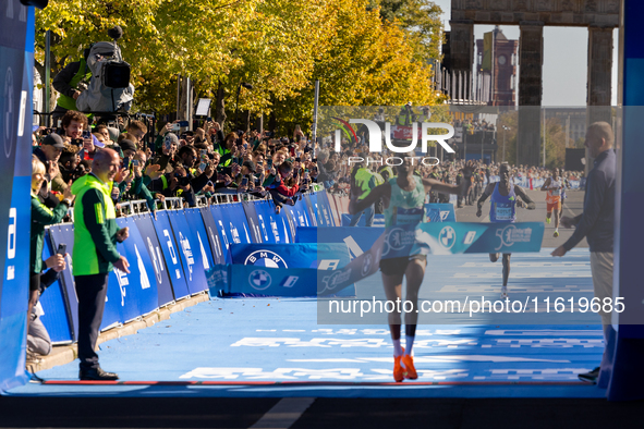 Milkesa Mengesha of Ethiopia wins the 50th Berlin Marathon in Berlin, Germany, on September 29, 2024, with a time of 2:03:17, followed by Cy...