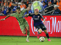 Cincinnati midfielder Luca Orellano moves the ball upfield during the Major League Soccer match between FC Cincinnati and Los Angeles FC at...