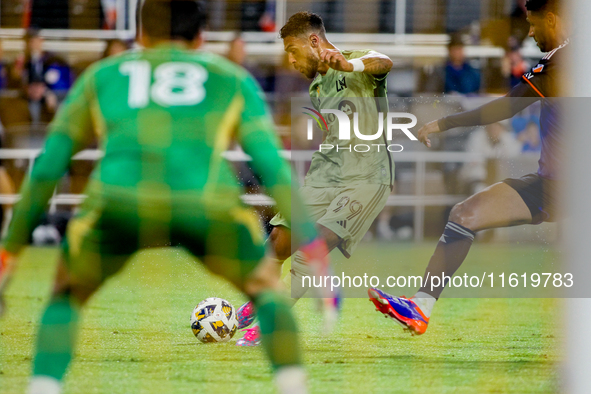 LAFC attacker Denis Bouanga shoots and scores a second-half goal during the Major League Soccer match between FC Cincinnati and Los Angeles...