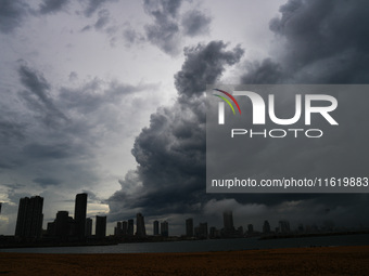 Dark clouds appear over the skyline in Colombo, Sri Lanka, on September 29, 2024. (