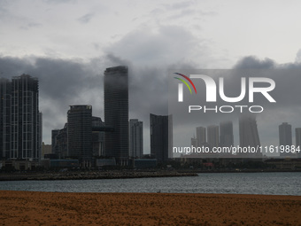 Dark clouds appear over the skyline in Colombo, Sri Lanka, on September 29, 2024. (