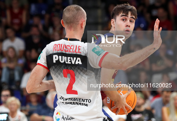 Juan Nunez and Jonathan Roussellle play during the match between FC Barcelona and Coviran Granada, corresponding to week 1 of the Liga Endes...