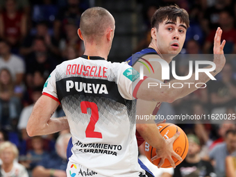 Juan Nunez and Jonathan Roussellle play during the match between FC Barcelona and Coviran Granada, corresponding to week 1 of the Liga Endes...