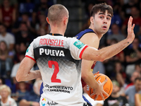 Juan Nunez and Jonathan Roussellle play during the match between FC Barcelona and Coviran Granada, corresponding to week 1 of the Liga Endes...