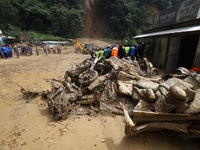 Debris of passenger vehicles excavated by Nepali security personnel while searching for missing passengers lies on the site of a landslide i...