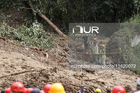 Local volunteers aiding the search operation at Jhyaple Khola in Dhading District of Central Nepal inspect the area in Dhading District, Nep...