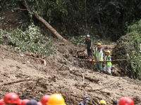 Local volunteers aiding the search operation at Jhyaple Khola in Dhading District of Central Nepal inspect the area in Dhading District, Nep...