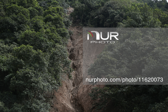 A general view of the downhill section from where the mud slides down the highway in Jhyaple Khola in Dhading District of Central Nepal on S...