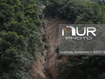 A general view of the downhill section from where the mud slides down the highway in Jhyaple Khola in Dhading District of Central Nepal on S...