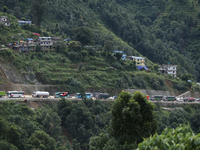 Vehicles stranded along the Tribhuvan Highway are pictured from Jhyaple Khola in Dhading District of Central Nepal on September 29, 2024. At...