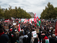 Protesters attend a demonstration in support of Lebanese people as intense Israeli attacks across Lebanon's east, south, and southern Beirut...