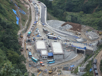 Stranded vehicles are pictured from Jhyaple Khola in Dhading District of Central Nepal after a landslide disrupts vehicular movement along t...