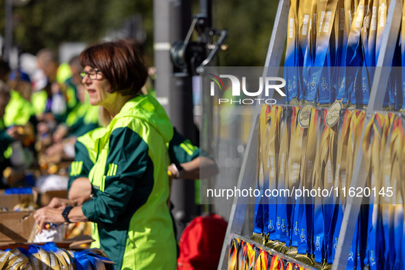 Volunteers organize medals to welcome the finishers of the Berlin Marathon in Berlin, Germany, on September 29, 2024. The 50th Berlin Marath...