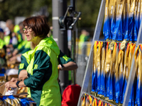 Volunteers organize medals to welcome the finishers of the Berlin Marathon in Berlin, Germany, on September 29, 2024. The 50th Berlin Marath...