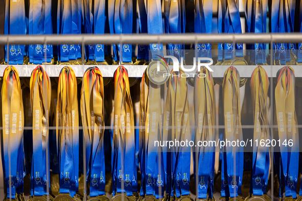 Volunteers organize medals to welcome the finishers of the Berlin Marathon in Berlin, Germany, on September 29, 2024. The 50th Berlin Marath...