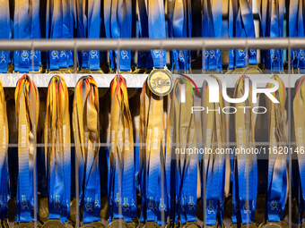 Volunteers organize medals to welcome the finishers of the Berlin Marathon in Berlin, Germany, on September 29, 2024. The 50th Berlin Marath...