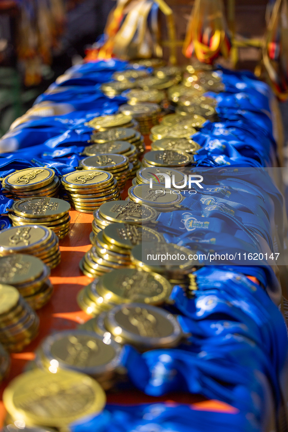 Volunteers organize medals to welcome the finishers of the Berlin Marathon in Berlin, Germany, on September 29, 2024. The 50th Berlin Marath...