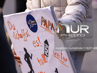 Spectators cheer on the runners during the 50th Berlin Marathon in Berlin, Germany, on September 29, 2024. The 50th Berlin Marathon brings t...