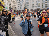 Spectators cheer on the runners during the 50th Berlin Marathon in Berlin, Germany, on September 29, 2024. The 50th Berlin Marathon brings t...