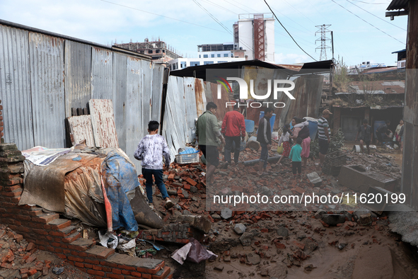 A section of walkways in Imadol, Lalitpur, Nepal, caves in after torrential rainfall and waterlogging on September 29, 2024. Nepal witnesses...