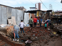 A section of walkways in Imadol, Lalitpur, Nepal, caves in after torrential rainfall and waterlogging on September 29, 2024. Nepal witnesses...