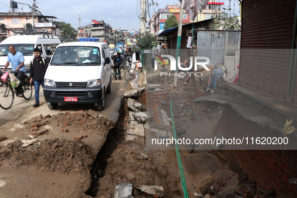 A section of walkways in Imadol, Lalitpur, Nepal, caves in after torrential rainfall and waterlogging on September 29, 2024. Nepal witnesses...