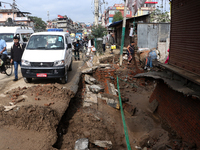 A section of walkways in Imadol, Lalitpur, Nepal, caves in after torrential rainfall and waterlogging on September 29, 2024. Nepal witnesses...