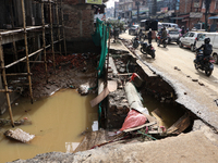 A section of walkways in Imadol, Lalitpur, Nepal, caves in after torrential rainfall and waterlogging on September 29, 2024. Nepal witnesses...