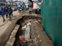 A section of walkways in Imadol, Lalitpur, Nepal, caves in after torrential rainfall and waterlogging on September 29, 2024. Nepal witnesses...