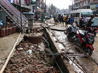 A section of walkways in Imadol, Lalitpur, Nepal, caves in after torrential rainfall and waterlogging on September 29, 2024. Nepal witnesses...