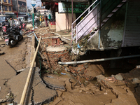 A section of walkways in Imadol, Lalitpur, Nepal, caves in after torrential rainfall and waterlogging on September 29, 2024. Nepal witnesses...