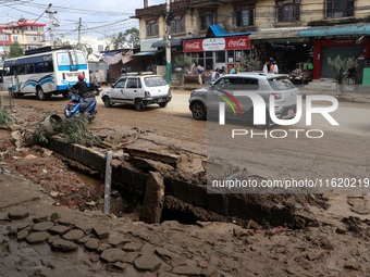 A section of walkways in Imadol, Lalitpur, Nepal, caves in after torrential rainfall and waterlogging on September 29, 2024. Nepal witnesses...