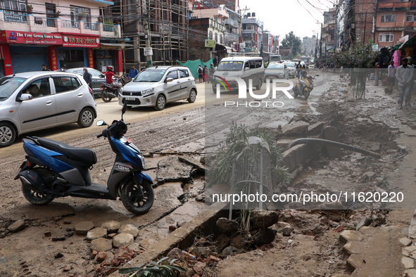 A section of walkways in Imadol, Lalitpur, Nepal, caves in after torrential rainfall and waterlogging on September 29, 2024. Nepal witnesses...