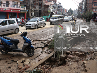 A section of walkways in Imadol, Lalitpur, Nepal, caves in after torrential rainfall and waterlogging on September 29, 2024. Nepal witnesses...