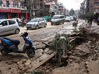 A section of walkways in Imadol, Lalitpur, Nepal, caves in after torrential rainfall and waterlogging on September 29, 2024. Nepal witnesses...