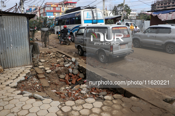 A section of walkways in Imadol, Lalitpur, Nepal, caves in after torrential rainfall and waterlogging on September 29, 2024. Nepal witnesses...