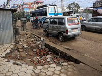 A section of walkways in Imadol, Lalitpur, Nepal, caves in after torrential rainfall and waterlogging on September 29, 2024. Nepal witnesses...