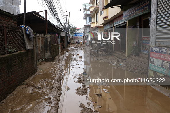 A passenger way in Imadol, Lalitpur, Nepal, on September 29, 2024, is covered in mud after heavy rain triggers waterlogging in the area. Nep...