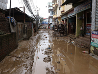 A passenger way in Imadol, Lalitpur, Nepal, on September 29, 2024, is covered in mud after heavy rain triggers waterlogging in the area. Nep...