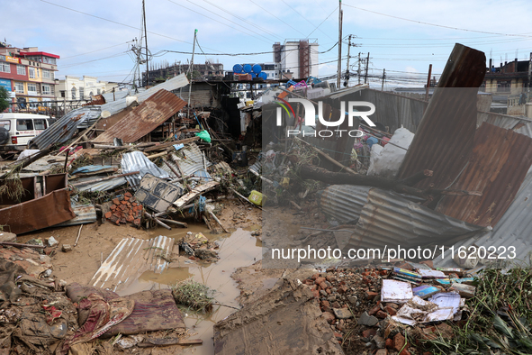 A passenger way in Imadol, Lalitpur, Nepal, on September 29, 2024, is covered in mud after heavy rain triggers waterlogging in the area. Nep...