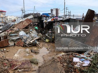 A passenger way in Imadol, Lalitpur, Nepal, on September 29, 2024, is covered in mud after heavy rain triggers waterlogging in the area. Nep...