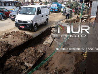 A section of walkways in Imadol, Lalitpur, Nepal, caves in after torrential rainfall and waterlogging on September 29, 2024. Nepal witnesses...