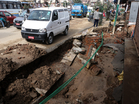 A section of walkways in Imadol, Lalitpur, Nepal, caves in after torrential rainfall and waterlogging on September 29, 2024. Nepal witnesses...